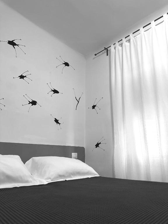 Postel nebo postele na pokoji v ubytování Boutique Hotel Novecento