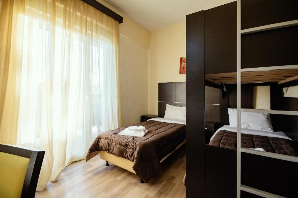 Postel nebo postele na pokoji v ubytování Marco Polo Hotel