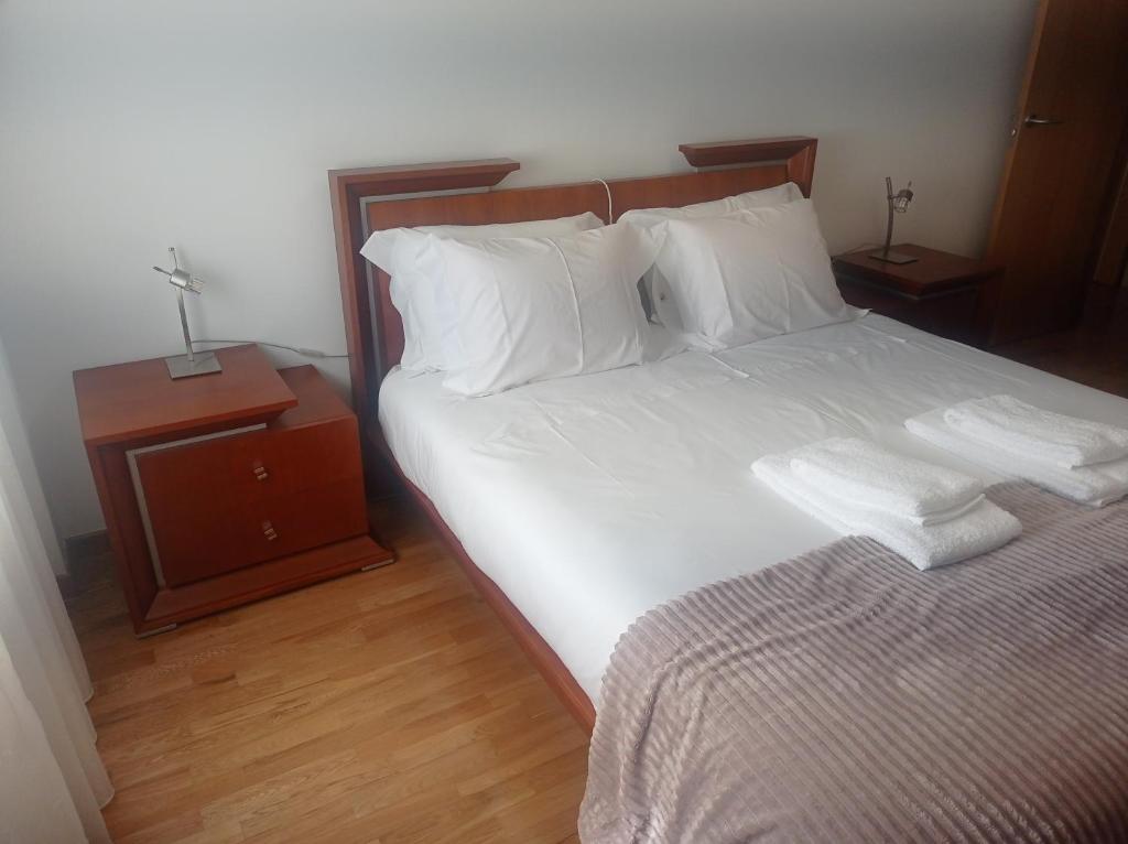 Postel nebo postele na pokoji v ubytování Apartamentos Vila Verde