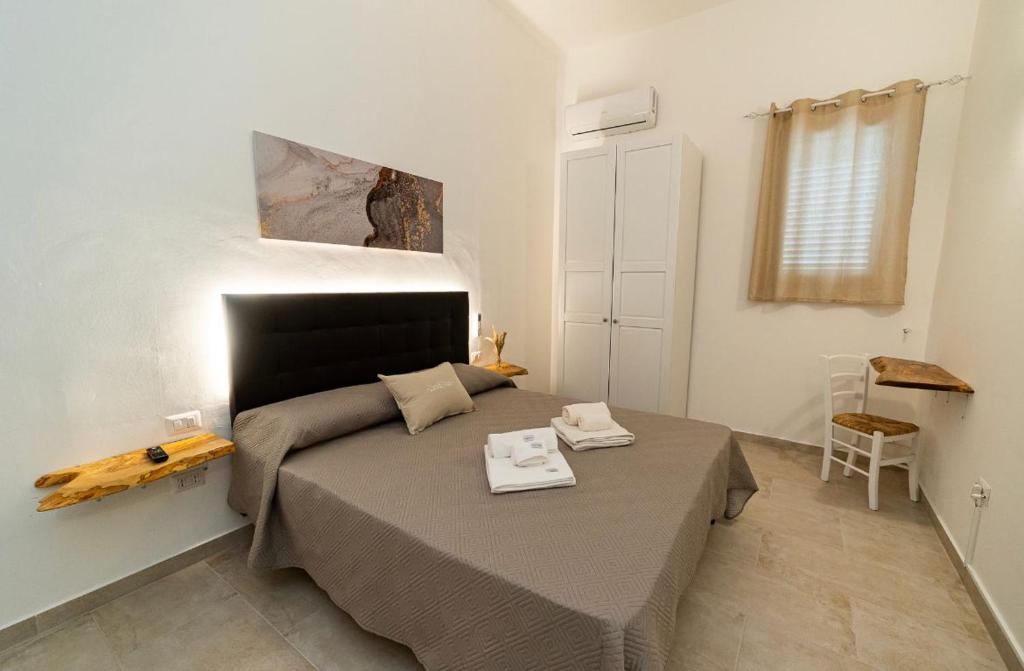 En eller flere senge i et værelse på L’Arte di Vittorio Bed and Breakfast