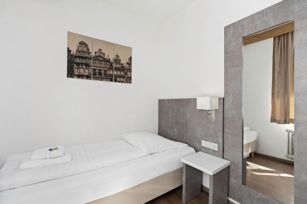 Postel nebo postele na pokoji v ubytování Hotel Adler