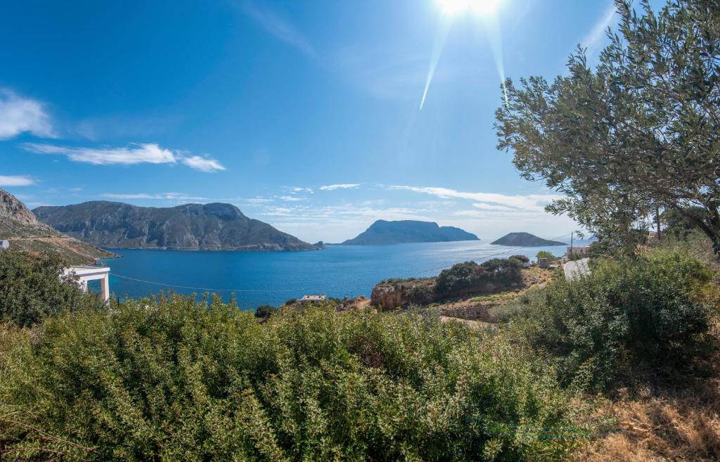 a view of a large body of water with mountains at Maria Nik Psaras House in Kalymnos