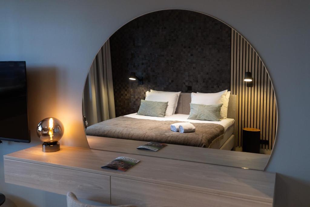 Een bed of bedden in een kamer bij Veluwe Hotel De Beyaerd