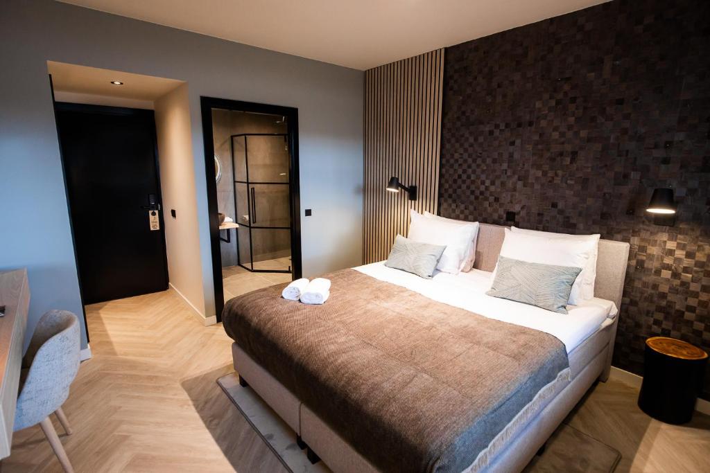 Een bed of bedden in een kamer bij Veluwe Hotel De Beyaerd