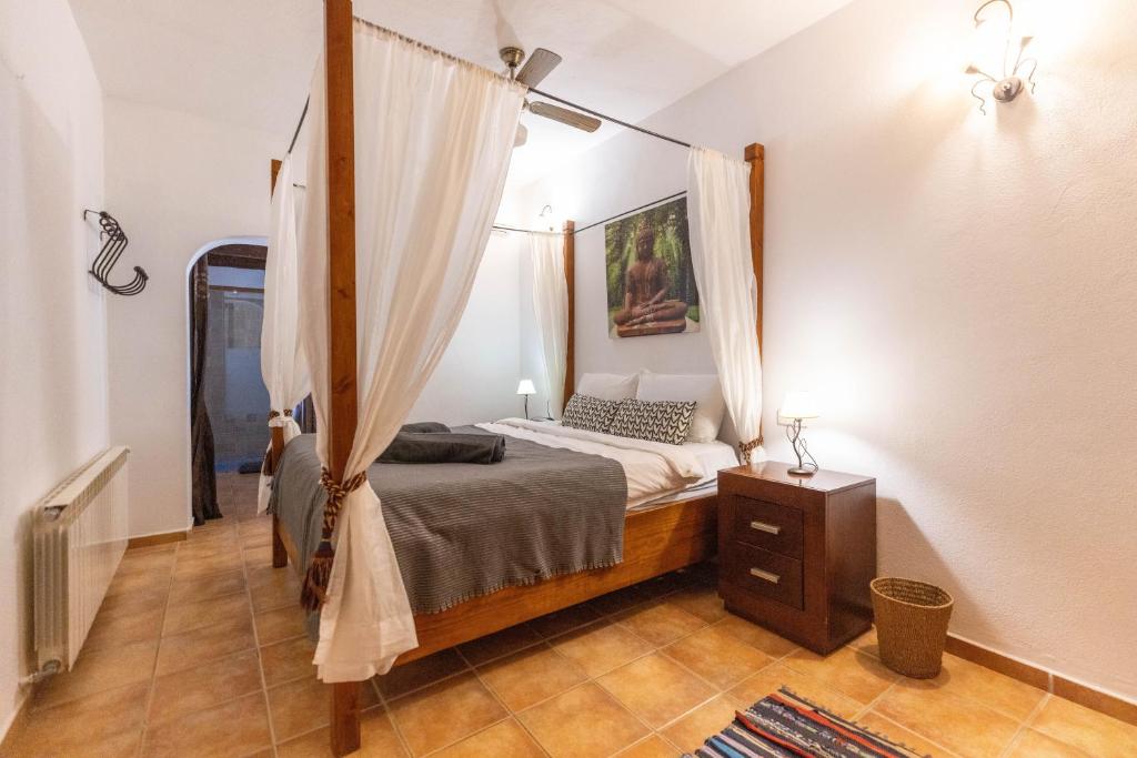 Postel nebo postele na pokoji v ubytování Villa Miguel