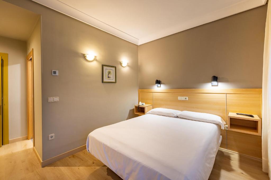 Postel nebo postele na pokoji v ubytování Hotel Santamaria