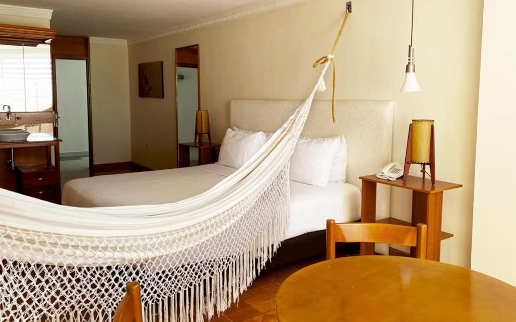 Postel nebo postele na pokoji v ubytování Hotel Sicarare
