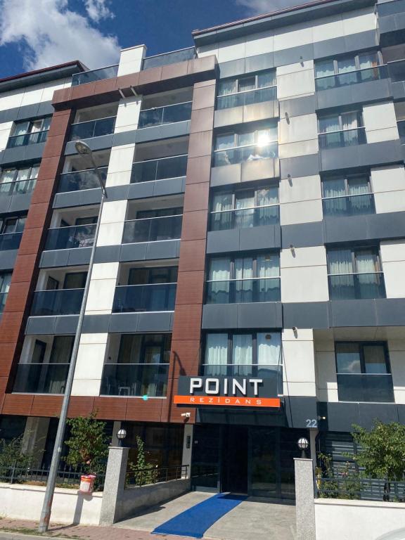 a large building with a point sign on it at pointrezidans in Ankara
