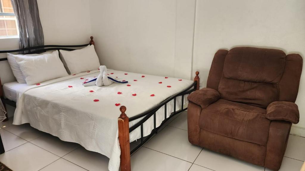 Postel nebo postele na pokoji v ubytování Caribbean Dream CD5