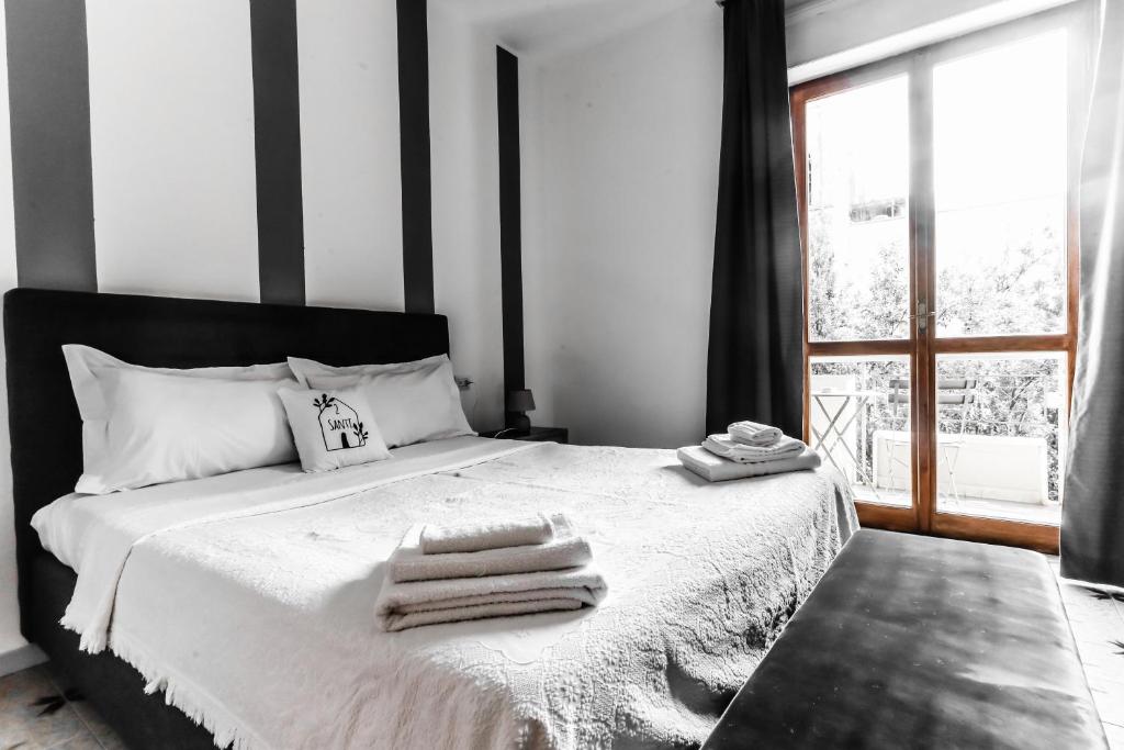 Postel nebo postele na pokoji v ubytování 2 Santi - Suite and Rooms