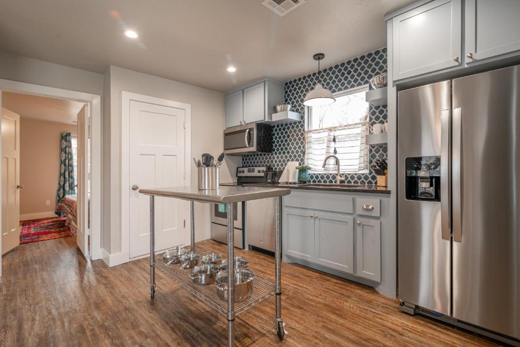 a kitchen with a counter and a refrigerator at Plaza Pad II-Near Plaza District in Oklahoma City