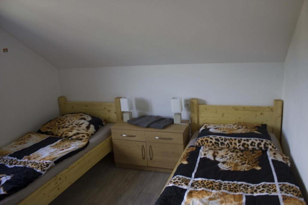 Postel nebo postele na pokoji v ubytování Apartmány u Dlouhána