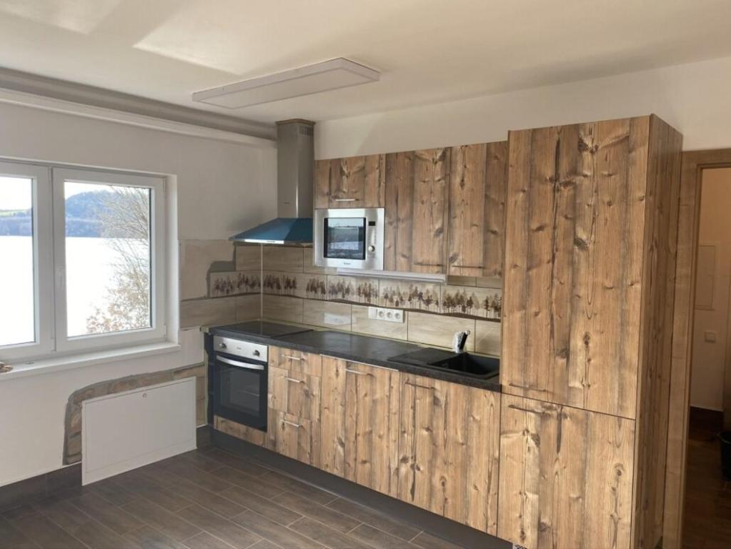 Kuchyň nebo kuchyňský kout v ubytování Apartmány u Dlouhána
