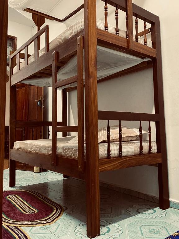 Postel nebo postele na pokoji v ubytování Sanaa Hostel