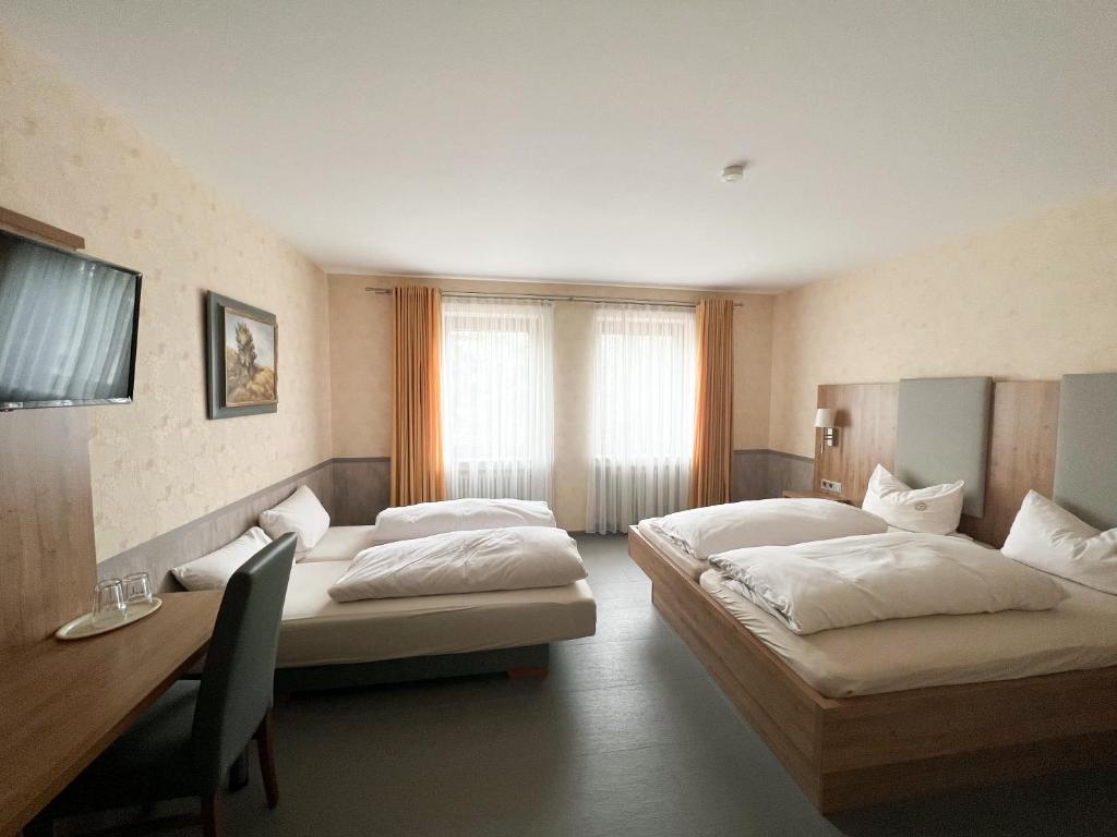 Postel nebo postele na pokoji v ubytování Hotel Garni Illertal