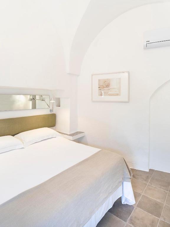 Postel nebo postele na pokoji v ubytování Masseria Alchimia