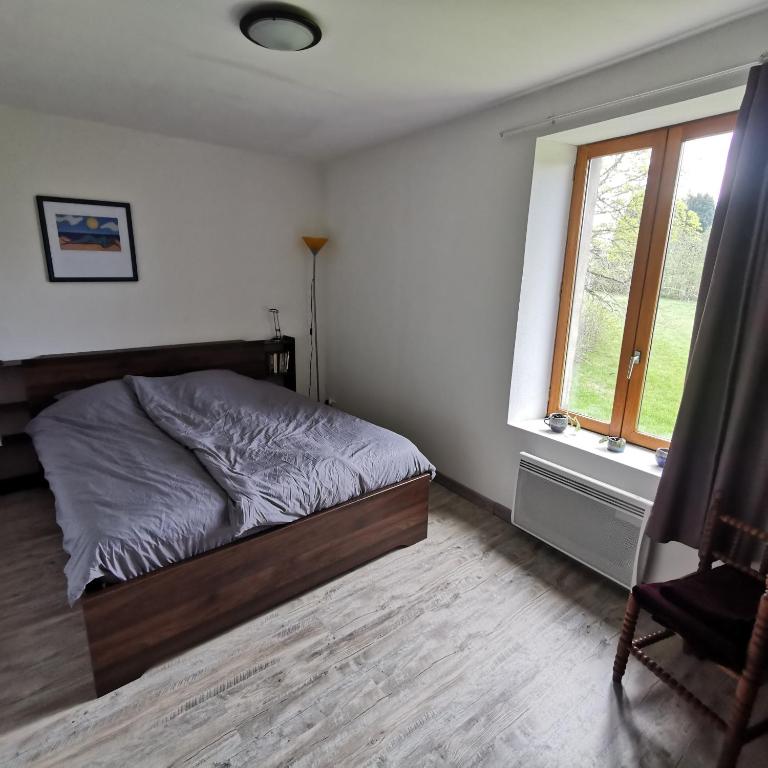 Postel nebo postele na pokoji v ubytování Auberge du Précontent
