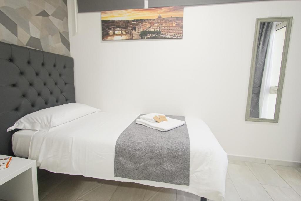 Postel nebo postele na pokoji v ubytování Hotel Terrazza Magenta