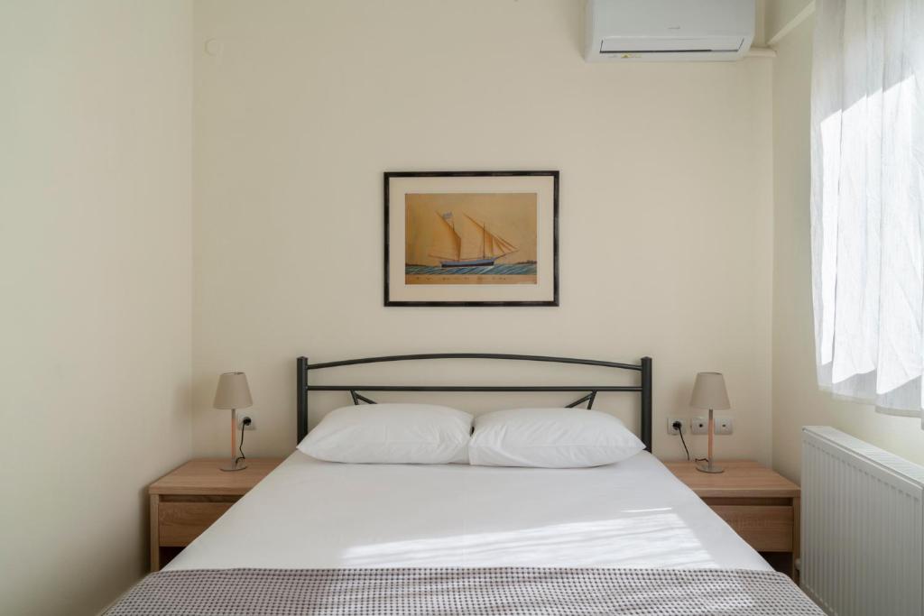 Ένα ή περισσότερα κρεβάτια σε δωμάτιο στο Alexandros Maisonettes & Apartments