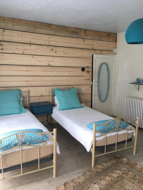 Postel nebo postele na pokoji v ubytování Atipyk'ododo