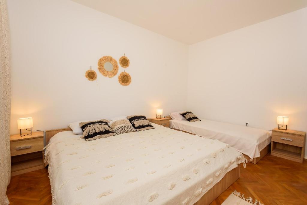 Postel nebo postele na pokoji v ubytování Apartman Stela