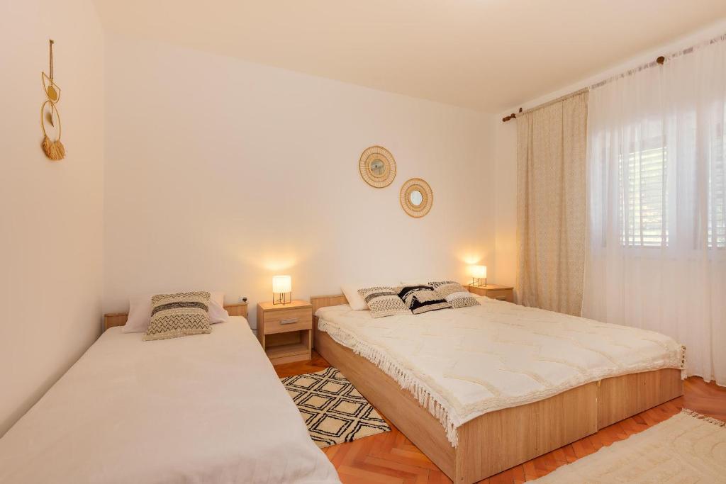 Postel nebo postele na pokoji v ubytování Apartman Stela