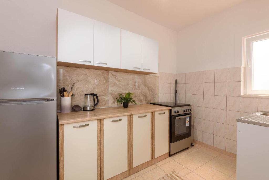Kuchyň nebo kuchyňský kout v ubytování Apartman Stela