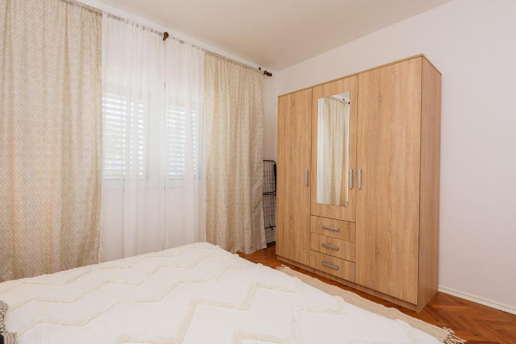Postel nebo postele na pokoji v ubytování Apartman Stela