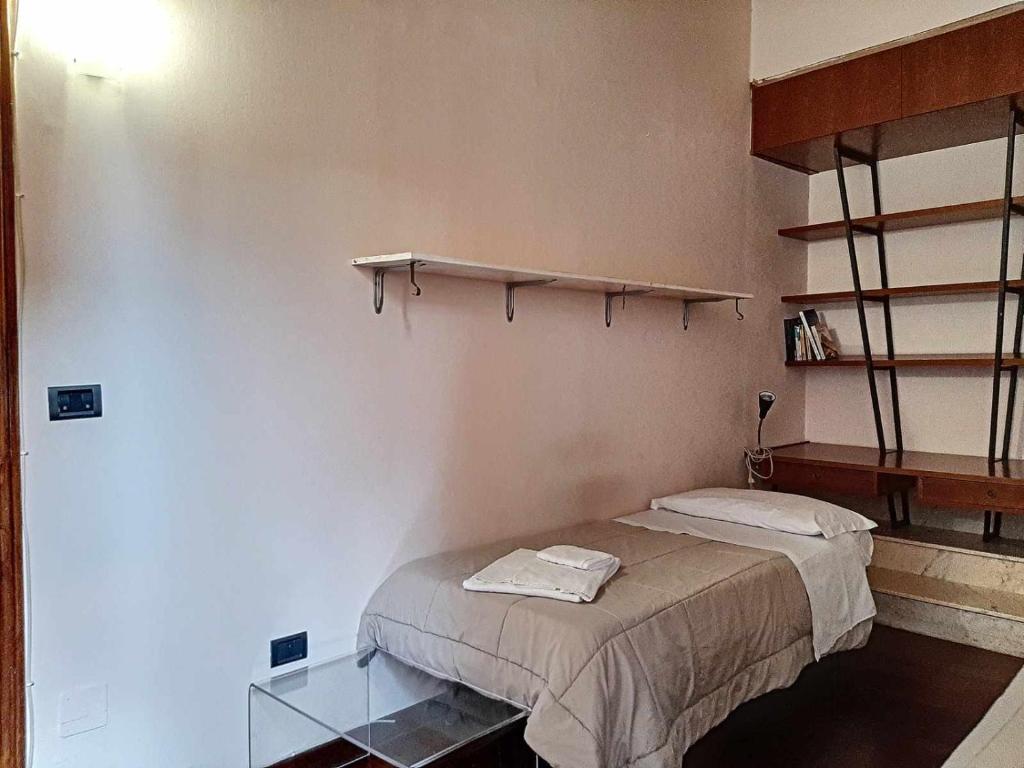Posteľ alebo postele v izbe v ubytovaní Ospitaci Appartamenti San Salvatore
