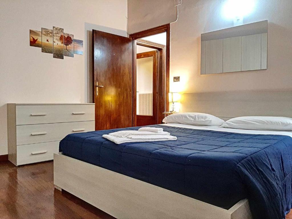 Posteľ alebo postele v izbe v ubytovaní Ospitaci Appartamenti San Salvatore