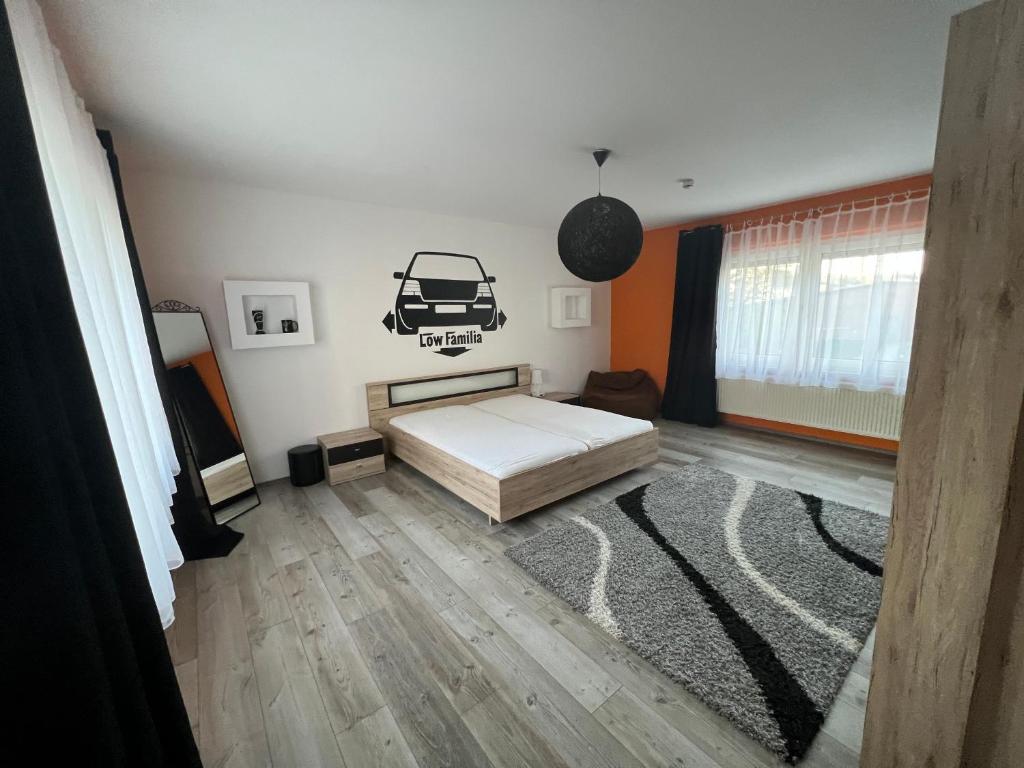a bedroom with a bed with a car on the wall at Ferienwohnung Hügelstraße in Wuppertal