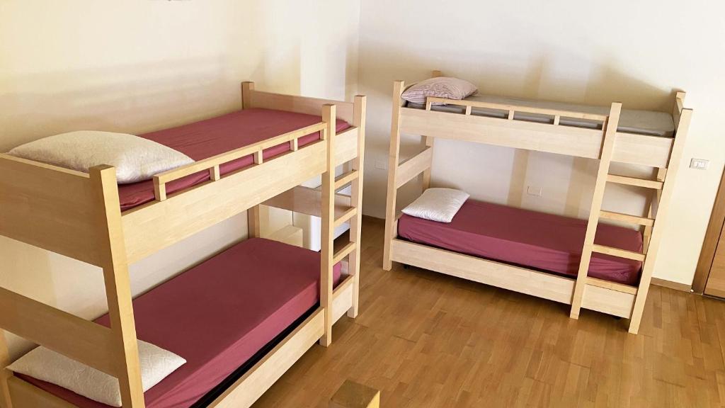Letto o letti in una camera di Rifugio Pian dei Ciclamini