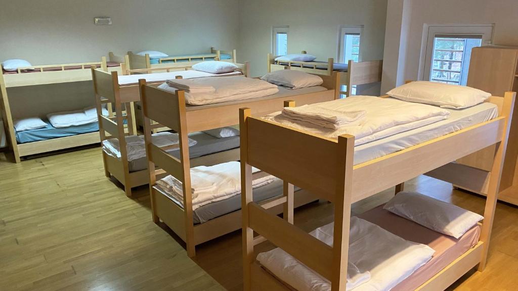 Letto o letti in una camera di Rifugio Pian dei Ciclamini