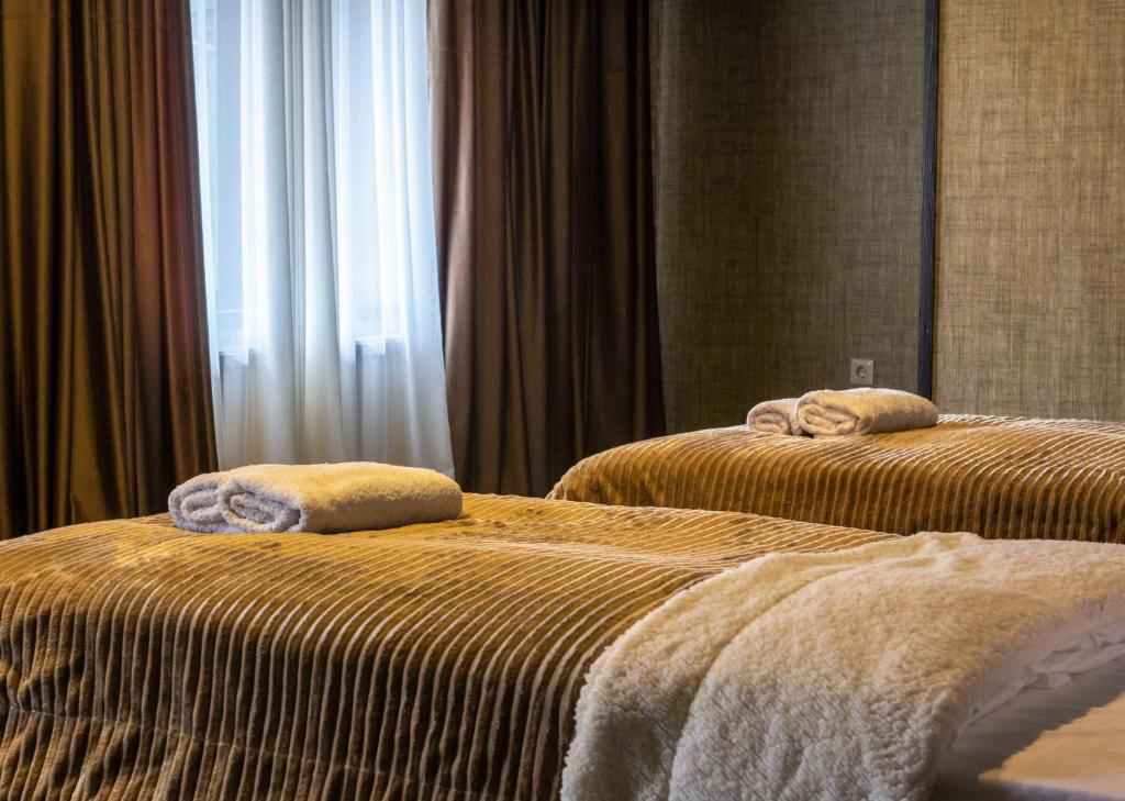 Postel nebo postele na pokoji v ubytování Hotel Eden