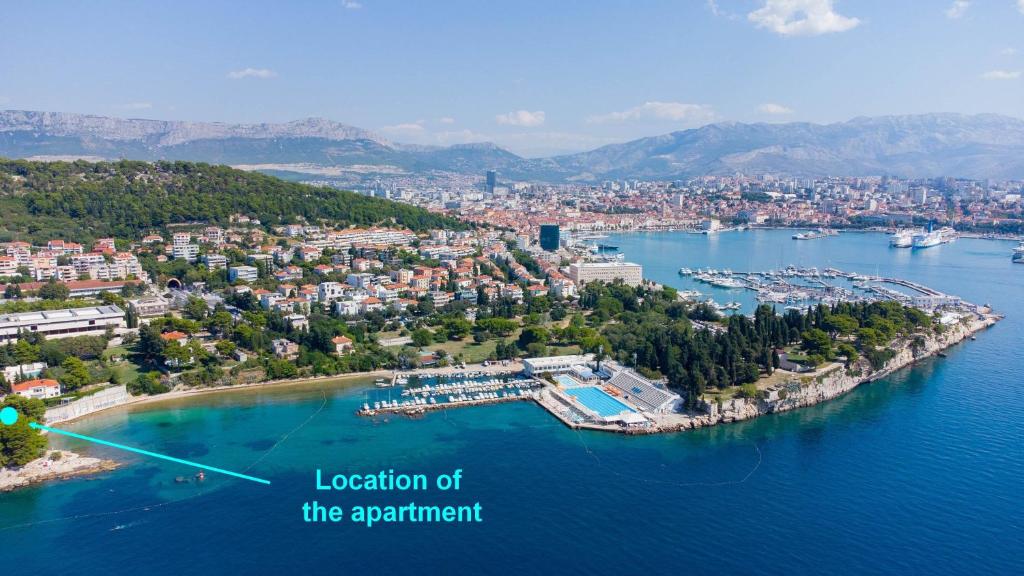 an aerial view of a city and a harbor at Beachfront apartment Drazen, with garden in Split