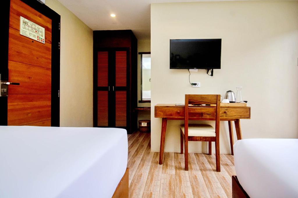Postel nebo postele na pokoji v ubytování Serene La Playa Boracay