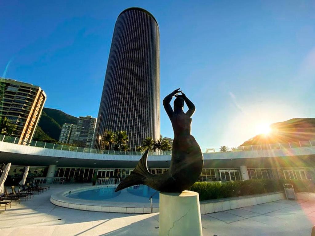 a statue of a mermaid in front of a building at HOTEL NACIONAL - Não tem café da manhã incluído in Rio de Janeiro