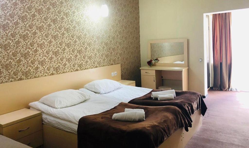 Postel nebo postele na pokoji v ubytování Guest House Vanda