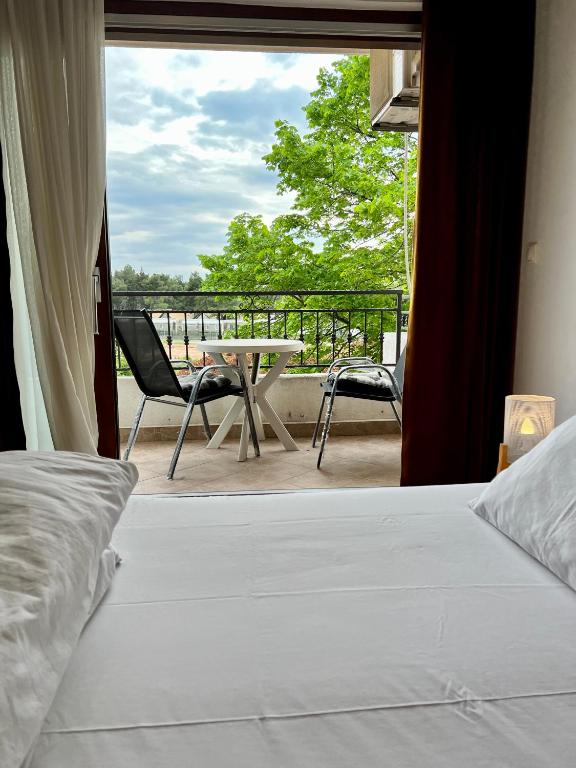 Łóżko lub łóżka w pokoju w obiekcie Rooms & Apartment Hegic