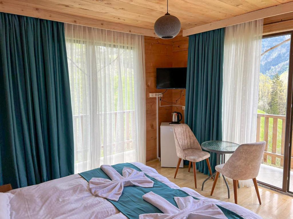Postel nebo postele na pokoji v ubytování Hotel Khulo lnn