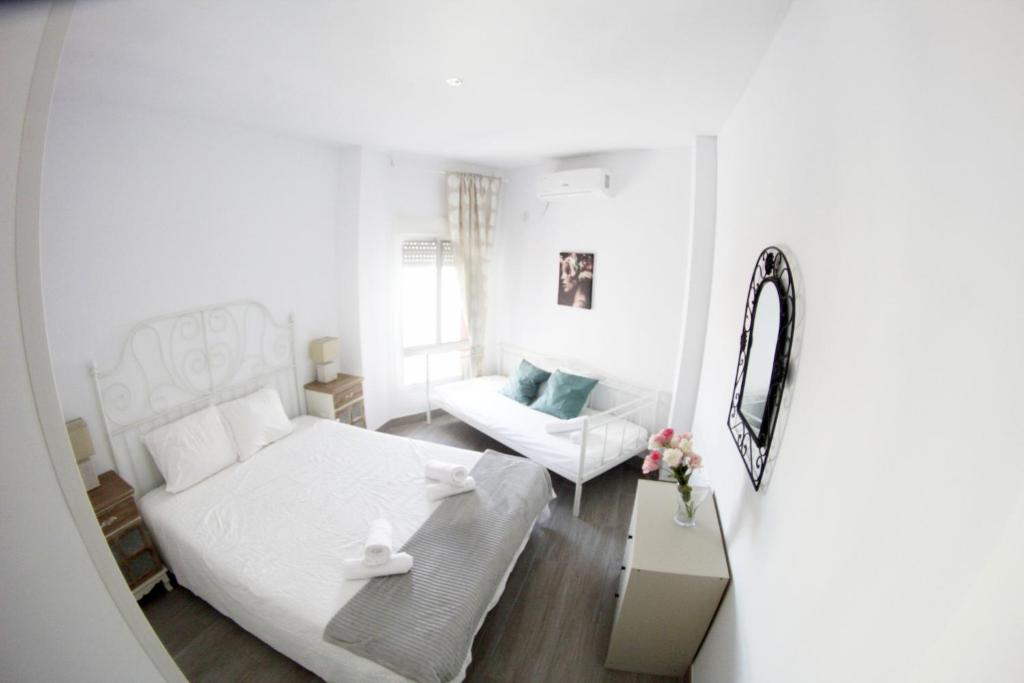 Posteľ alebo postele v izbe v ubytovaní Apartamento Piletas