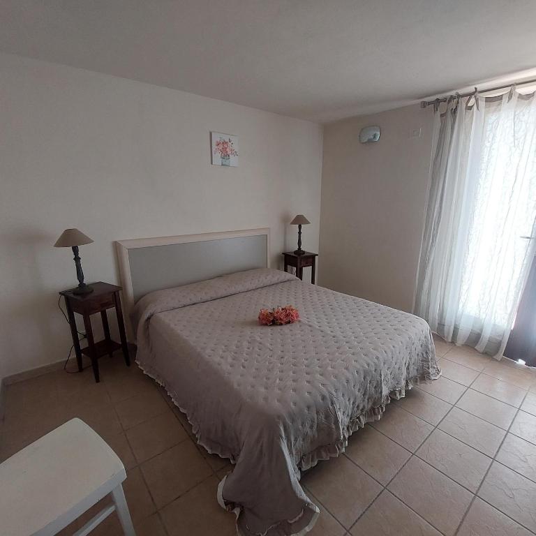 Postel nebo postele na pokoji v ubytování Podere Grandolfi B&B