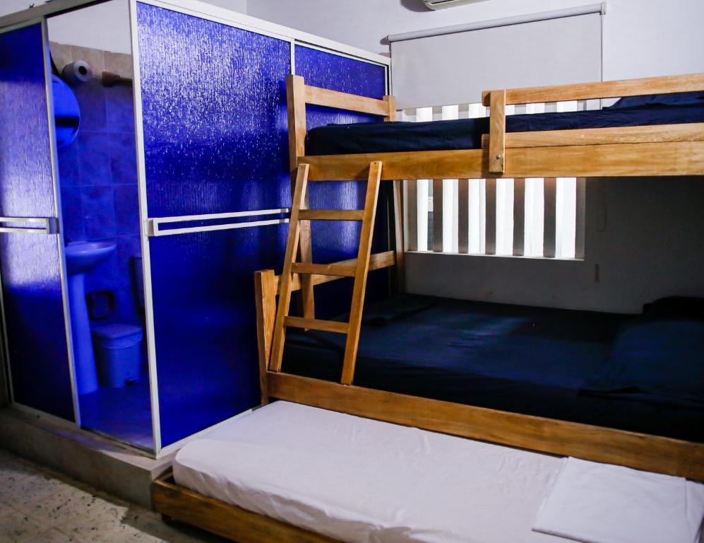 Postel nebo postele na pokoji v ubytování Cabaña Perla Azul