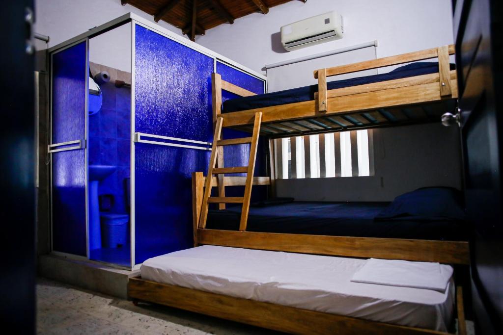 Postel nebo postele na pokoji v ubytování Cabaña Perla Azul