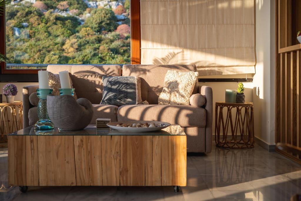 a living room with a couch and a coffee table at Villa Almy in Plaka