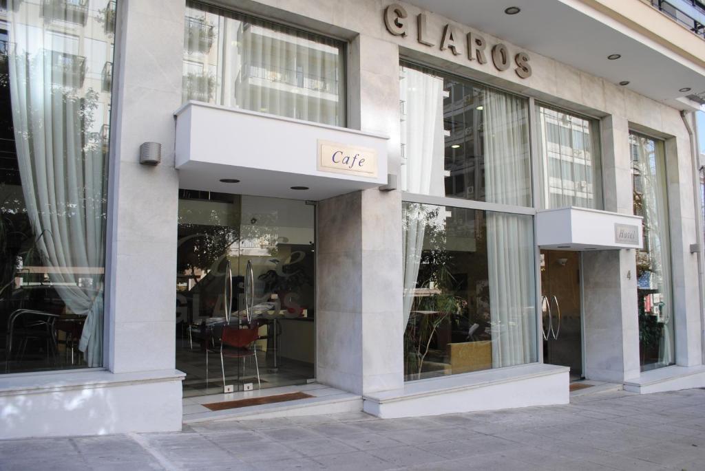 a store front of a building with glass windows at Glaros Hotel in Piraeus