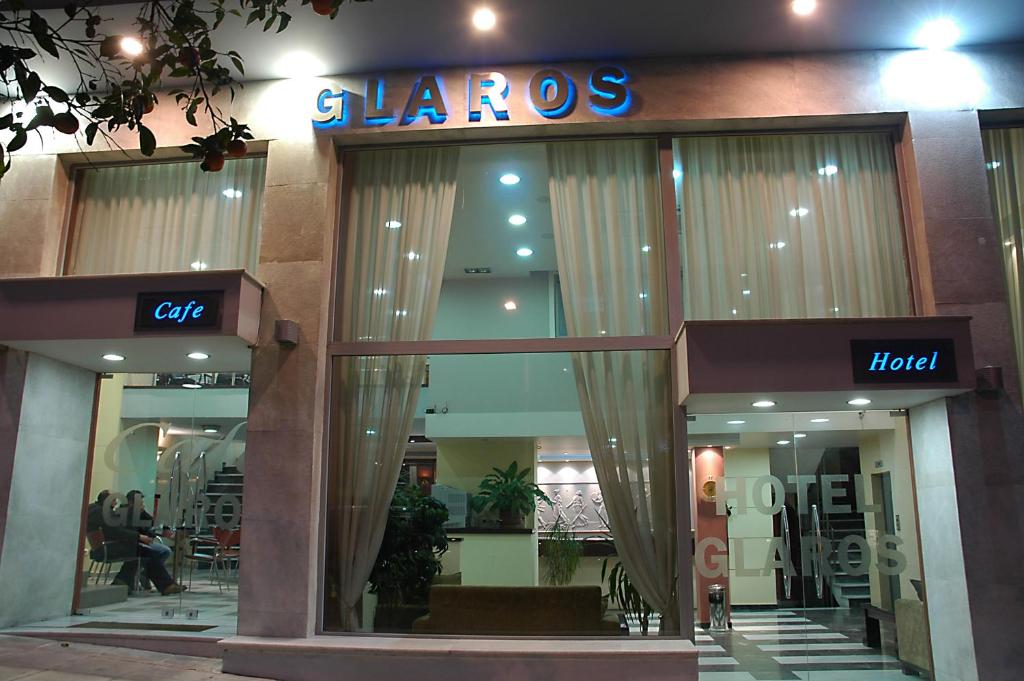 a store front of a store with a sign on it at Glaros Hotel in Piraeus