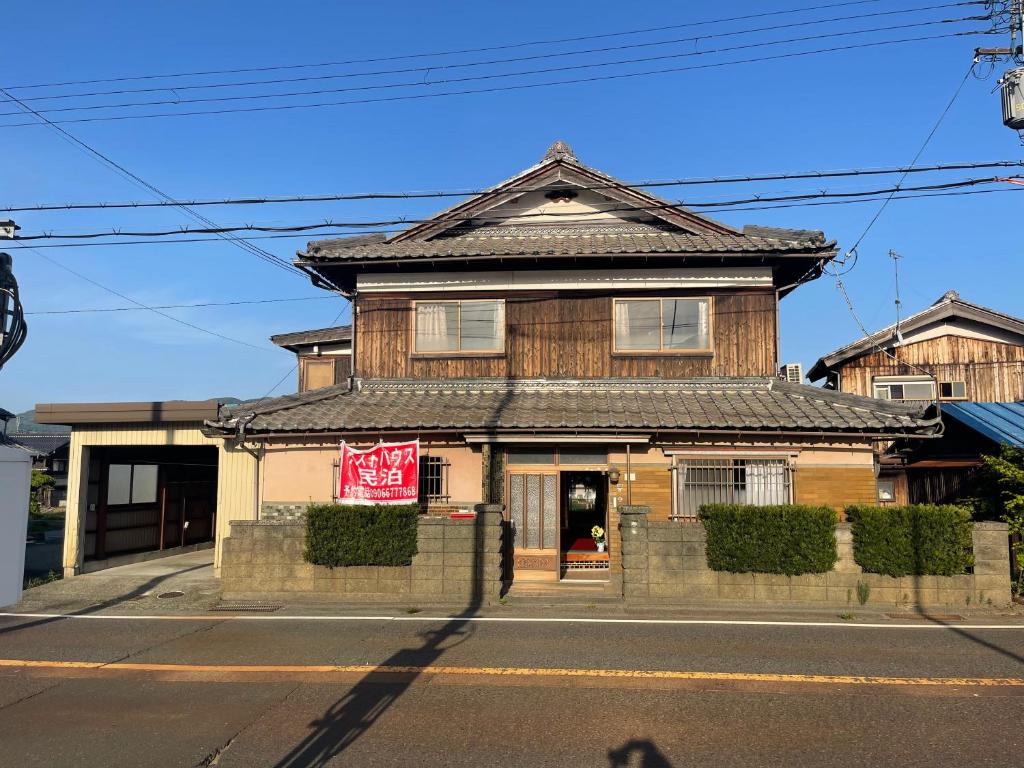 an old building on the corner of a street at 高島市マキノ町民泊お得 in Takashima