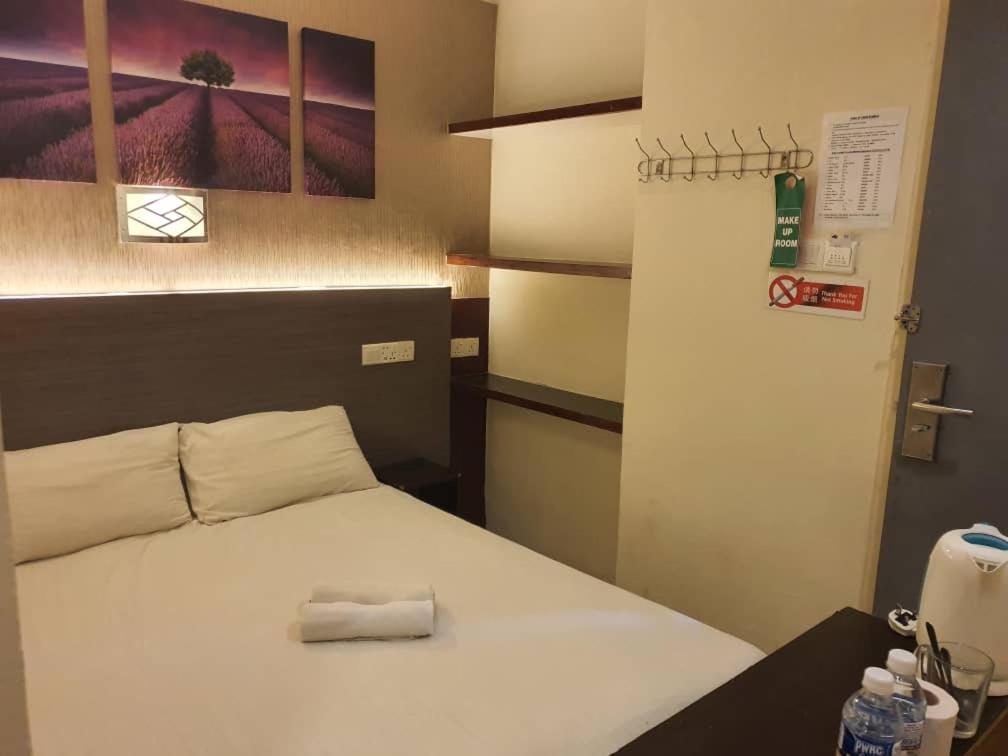 Postel nebo postele na pokoji v ubytování One Point Hotel