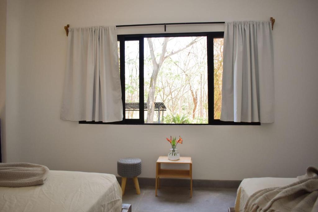 Postel nebo postele na pokoji v ubytování Blue Window Boutique Villas Hotel